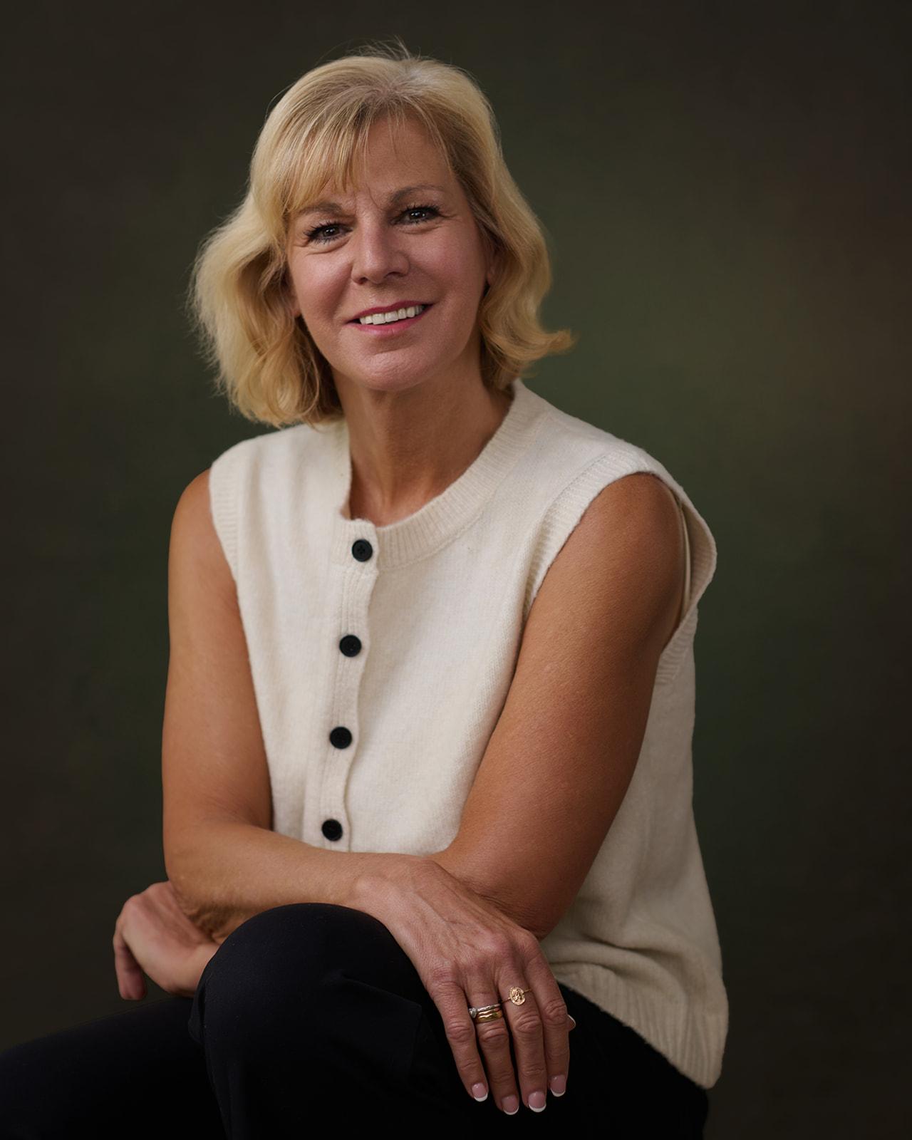 Portrait of Kerri in a cream knit vest